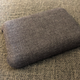 Foreground: A Nimble Qi charger. Background: My linen couch.